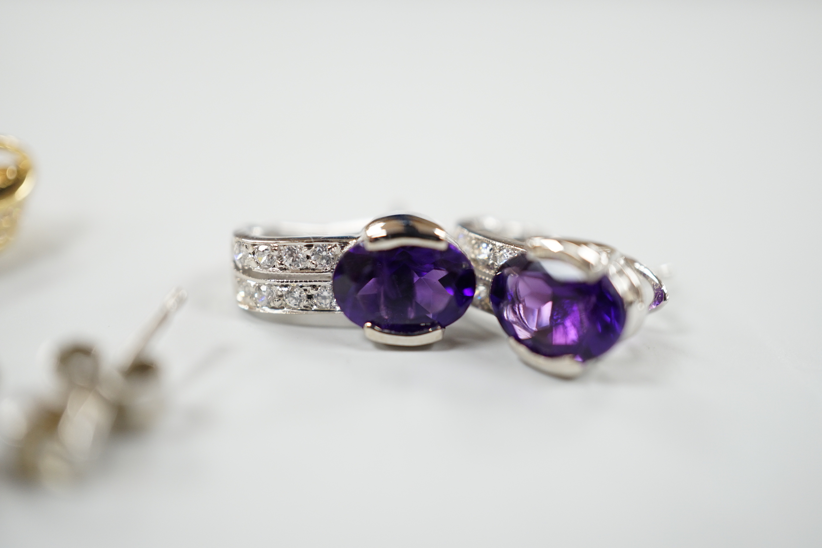 Four assorted modern pairs of 750 or 18ct gold and gem set earrings, including small solitaire diamond and two row diamond chip half hoop, 16mm, gross weight 10.1 grams.